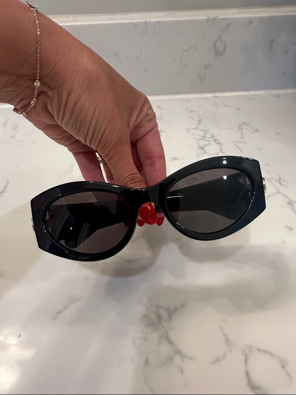 Gucci Black Cat-Eye Women's Sunglasses with Red Bridge Accent